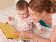 Caregiver reading to a baby